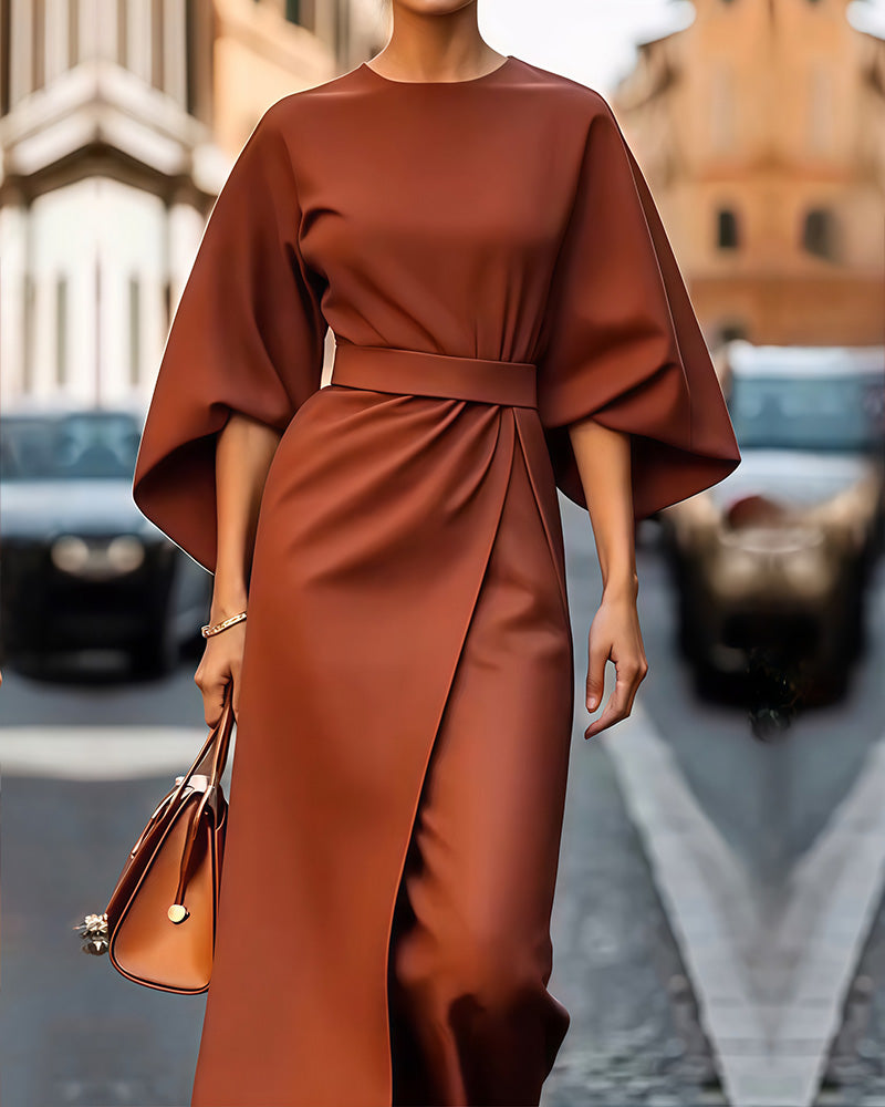 Nada jurk met elegante lampas mouwen en riem